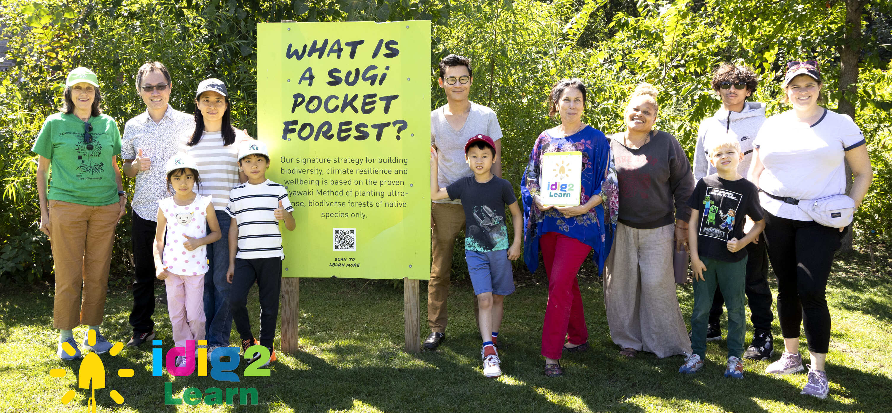 People looking over a river at a city skyline